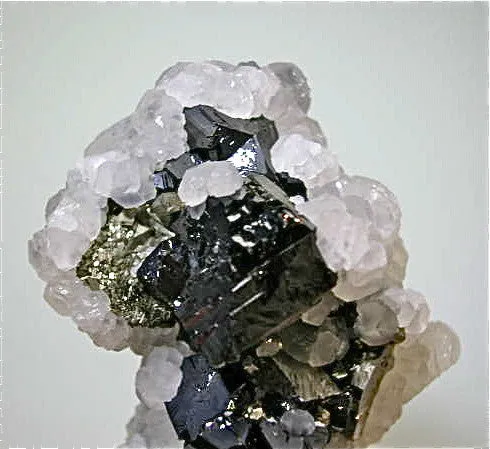 Calcite on Pyrite after Pyrrhotite with Arsenopyrite and Sphalerite, Trepca Complex near Mitrovica, Kosovska Municipality, Kosovo, Mined 2014, Miniature 3.5 X 5.0 X 5.0 cm, $125.  Online 8/19. SOLD.