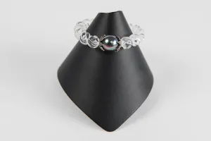 Carved rock crystal with mother of pearl and pave diamond bead caps