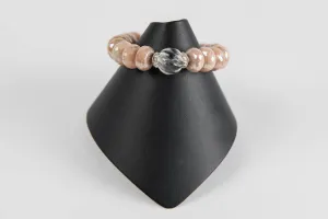 Faceted peach moonstone with carved rock crystal bead