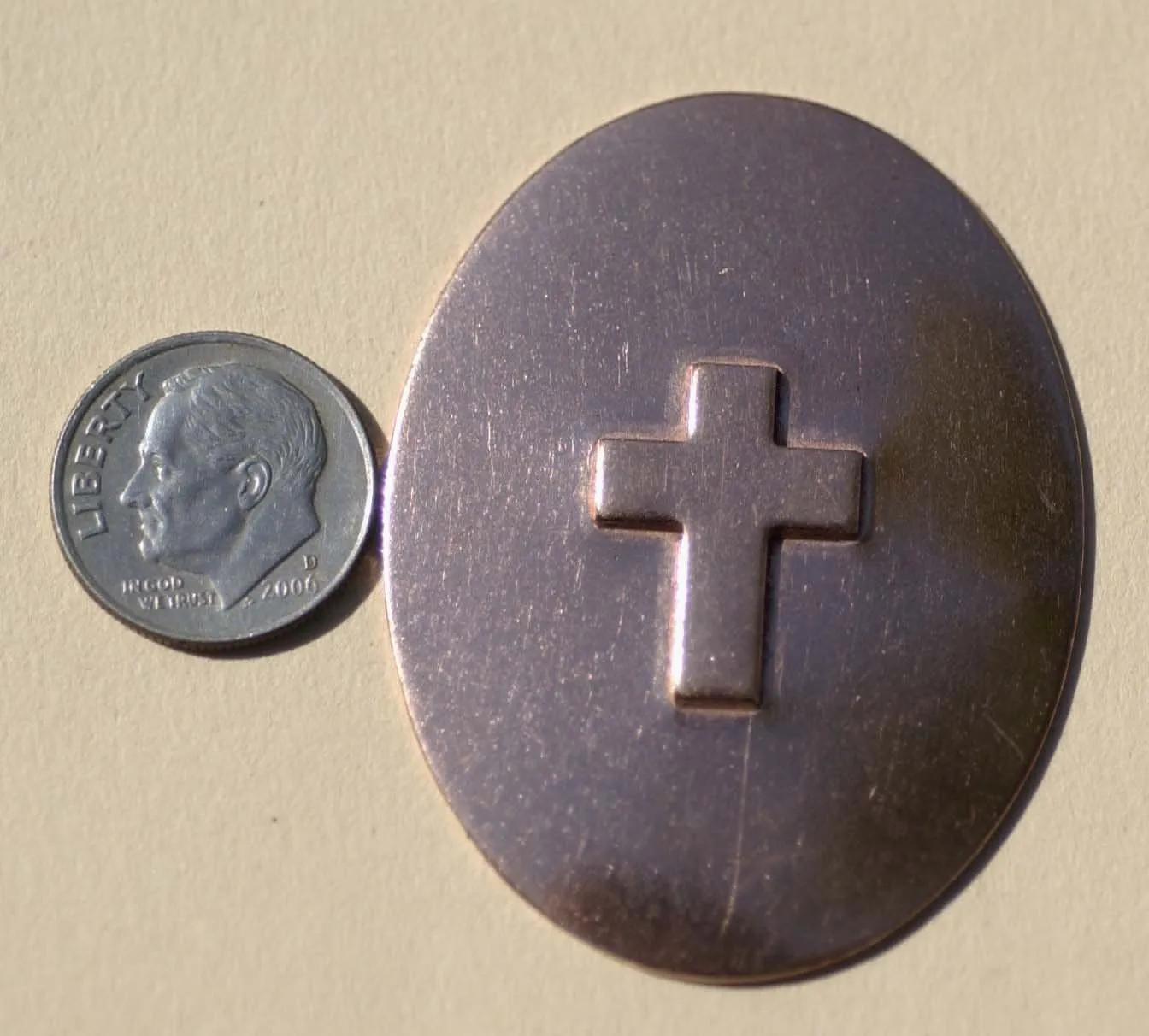 Large ovals with Cross Embossed on metal blanks